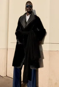 Full length view of elegant black faux fur shearling coat with leather lapel