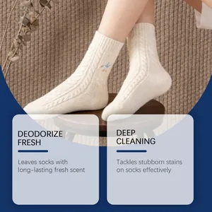 Close-up of clean cream cable-knit socks on feet showcasing deep cleaning effect