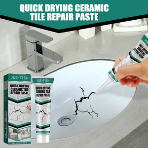 Hand applying quick drying ceramic tile repair paste to a cracked bathroom sink.