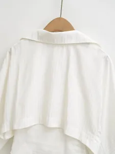 Back detail of white fake two-piece bodysuit shirt with subtle striped texture