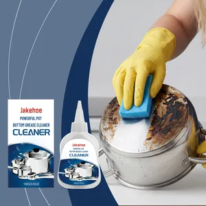 Close-up of pot bottom grease cleaner being applied to a dirty stainless steel pan