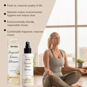 Premium Sugared Lemon Blossom room spray bottle with relaxing yoga meditation scene