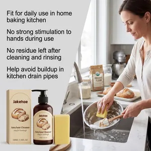 Amylase cleaner used by woman washing a kitchen bowl to remove sourdough residue.