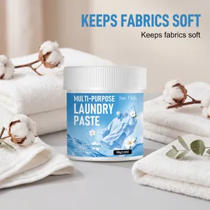 Detail shot of Jue Fish multi-purpose laundry paste with soft towels and cotton bolls.