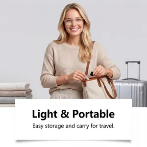Compact eyeglass anti-fog spray being placed in a travel bag for portable lens care.