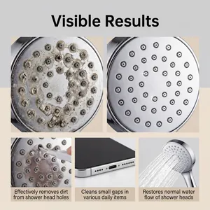 Close-up macro view of small gap cleaning brush removing dirt from shower head holes