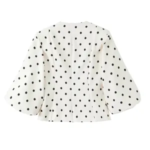 Vue arrière d'un blazer vintage français blanc à pois noirs avec manches bouffantes
