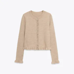 Beige round neck knitted cardigan with feminine ruffle trim details on hem and cuffs