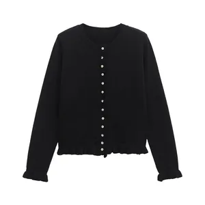 Elegant black round neck knit cardigan featuring ruffled hem details and delicate front buttons