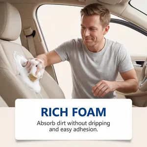 Detailed view of person cleaning beige leather car seat with rich multipurpose foam cleaner