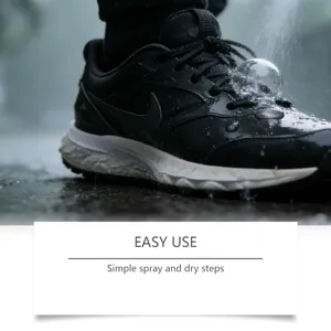 Macro view showing water repellent effect of shoe spray on a black sneaker