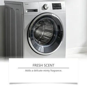 Close-up of a silver washing machine highlighting the fresh minty fragrance effect