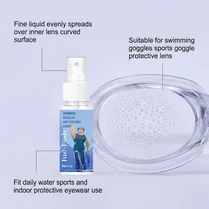 Close-up of Jue Fish anti-fogging spray bottle with a clear swimming goggle lens.