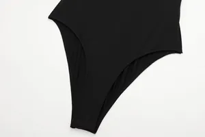 Close-up of black sleeveless bodysuit showing stitching and elastic fabric details
