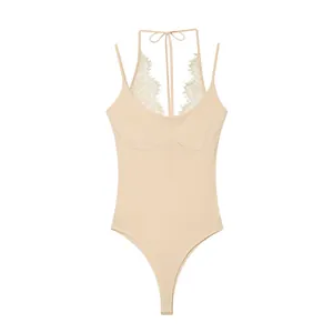 Elegant beige halter neck bodysuit featuring a delicate white lace patchwork trim.
