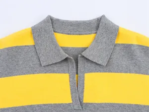 Macro view of grey and yellow horizontal striped polo collar on a knit sweater.