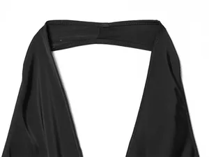 Close-up detail of the halter neck stitching and soft satin fabric on a black top.