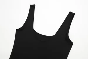 Detail shot of the U-neck and wide shoulder straps on a black sleeveless bodysuit