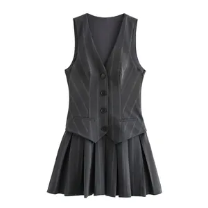 Front view of a stylish dark gray pinstriped vest dress featuring a pleated mini skirt