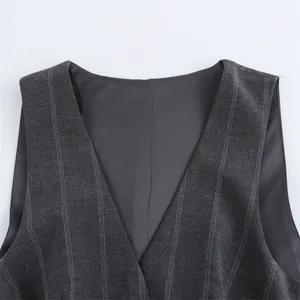 Detail of grey pinstriped V-neckline on a stylish sleeveless women's dress.