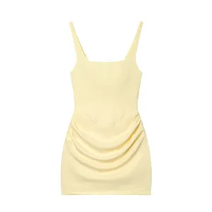 Pale yellow sleeveless mini dress with elegant square neckline and ruched skirt details