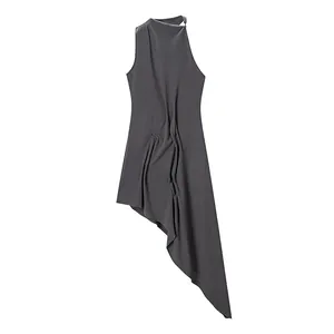 Close-up of grey sleeveless knitted dress featuring unique asymmetrical draped hem