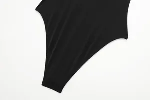 Close-up of the stretch fabric and stitching on a black knitted bodysuit