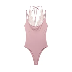 Detailed view of pink halter neck bodysuit with delicate lace patchwork and straps.