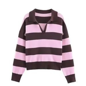 Close-up of pink and brown striped knit sweater with polo collar detail and V-neck