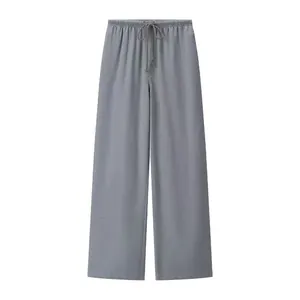 Detailed front view of grey casual wide-leg trousers featuring an elastic drawstring waist