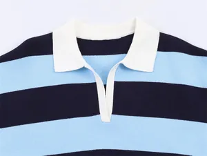 Close-up of a blue and navy striped knit sweater with a white polo collar detail