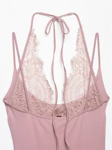 Close-up of dusty rose sleeveless bodysuit featuring delicate floral lace halter neck detail