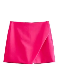 Detailed front view of a vibrant hot pink high-waisted asymmetrical wrap skort for women