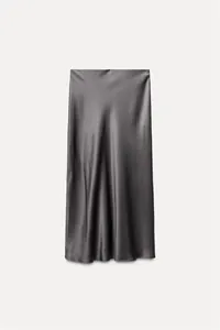 Close-up detail of a grey silk satin midi skirt featuring a smooth and lustrous texture