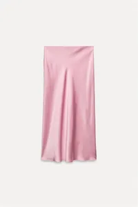 Detail view of the elegant pink satin midi skirt highlighting its silky fabric sheen