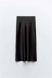 Detailed view of elegant black silk satin midi skirt with smooth drape and sheen
