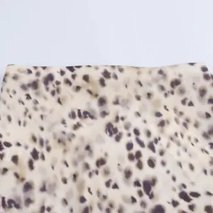 Close-up of leopard print satin midi skirt with elegant silky texture for women