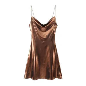 Detailed view of bronze metallic slip dress with elegant cowl neck and thin straps