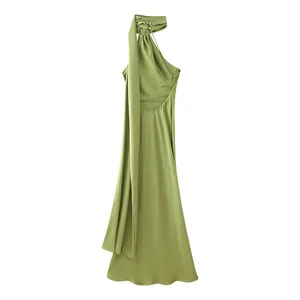 Elegant sage green halter-neck long dress with backless cutout and flowing sash detail.