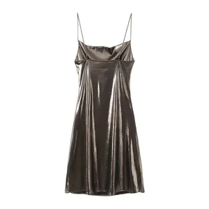 Front view of a sexy metallic silver camisole dress with thin straps and low neck