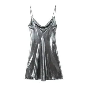 Metallic silver slip dress with cowl neck and spaghetti straps on white background