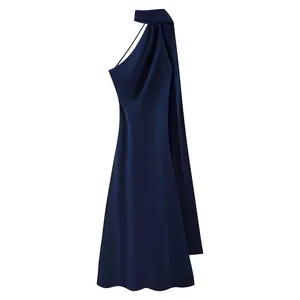 Detailed view of an elegant navy blue halter neck dress featuring a flowing back drape