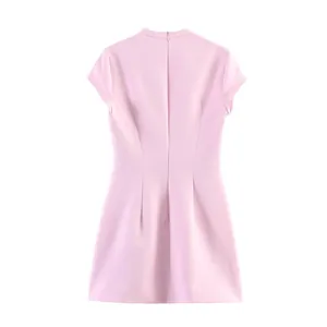 Back view of a stylish pink short-sleeved mini dress with a hidden zipper closure.