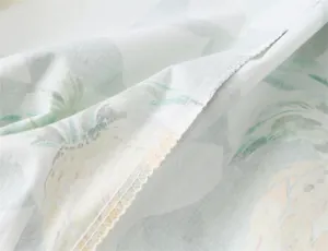Close-up detail of neat overlock stitching on a summer pineapple print dress fabric