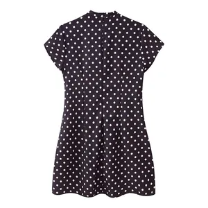 Detailed back view of a stylish black polka dot short sleeve dress with zipper closure.