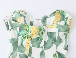 Detail of pineapple print bustier dress showing sweetheart neckline and side zipper