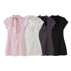 Retro polka dot mini dresses with keyhole cutout and bow tie detail in four colors.