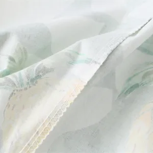 Detail of pineapple print dress featuring high-quality stitching and light fabric