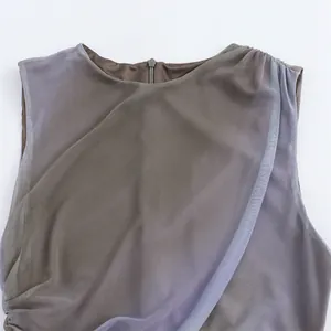 Close-up of sleeveless mesh midi dress with elegant pleated neckline and back zipper