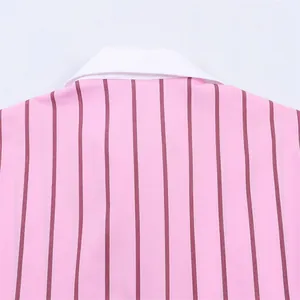 Close-up of white contrast collar and pink vertical striped fabric on a stylish casual shirt.